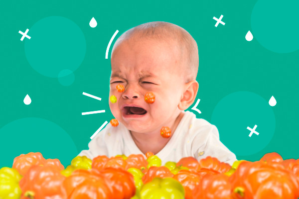 Bebê chorando e ao redor dele caem pitangas ilustrando o conceito da expressão "chorar as pitangas"