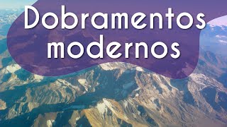 Título "O que são dobramentos modernos? "escrito sobre fundo de montanhas rochosas em ilusão aos dobramentos modernos.
